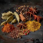 Welcome-&-Our-Food-Small-lcartwork_Indian_spices_on_a_dark_background._A_side_angled_clo_67139344-0d0a-4d81-bb8b-632b01053a86